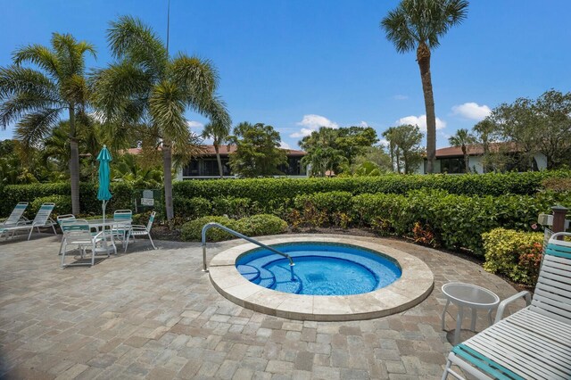 3500 El Conquistador Pkwy Unit 238, Bradenton, FL 34210 - view of pool featuring a community hot tub and a patio area