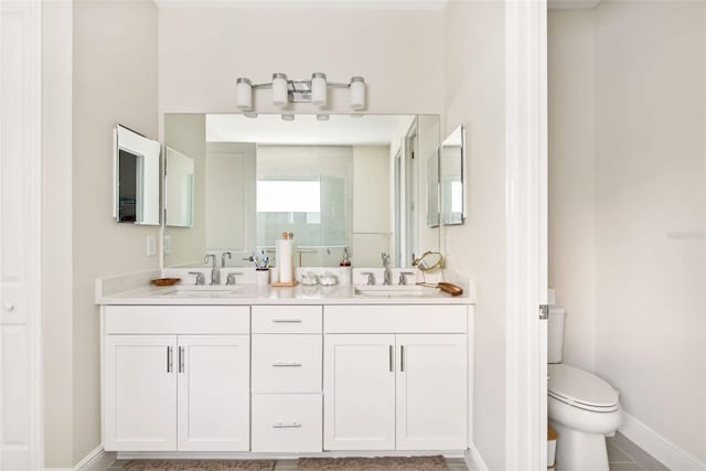 bathroom featuring tile patterned flooring, vanity, and toilet