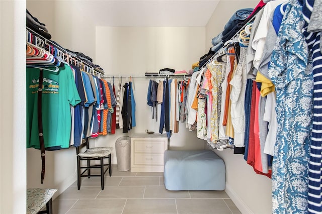 spacious closet featuring light tile patterned floors