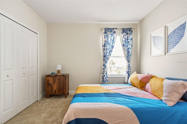 carpeted bedroom featuring a closet