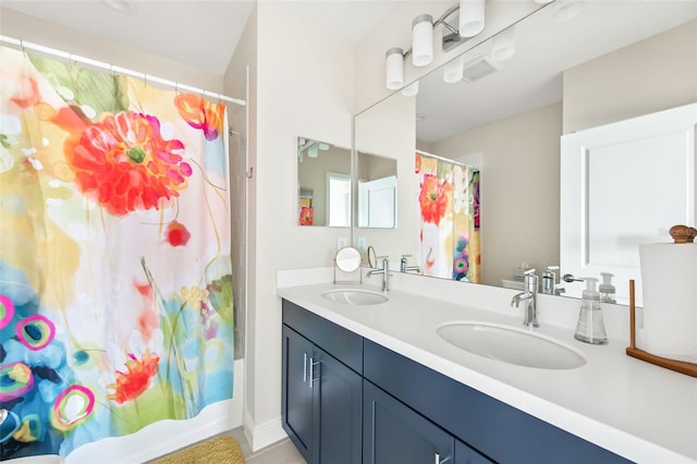 bathroom featuring vanity and shower / tub combo