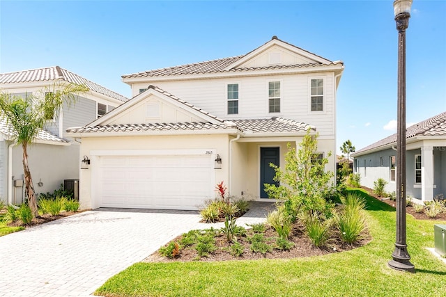 view of front facade featuring a garage and a front yard