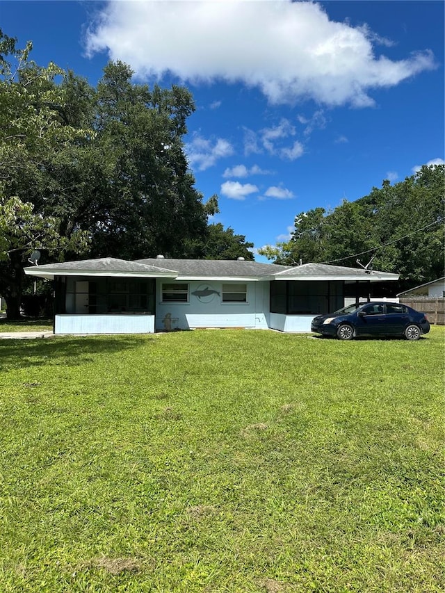 view of property exterior featuring a yard and a carport