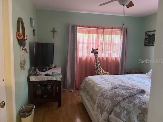 bedroom featuring wood-type flooring and ceiling fan