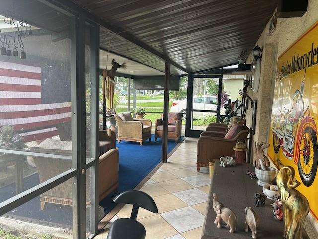 sunroom / solarium with lofted ceiling