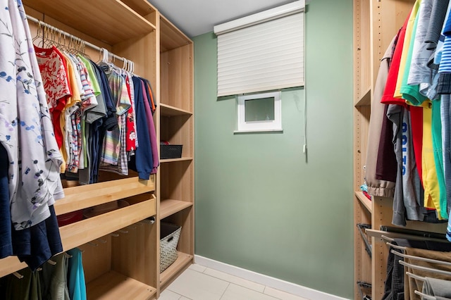 walk in closet featuring light tile patterned floors