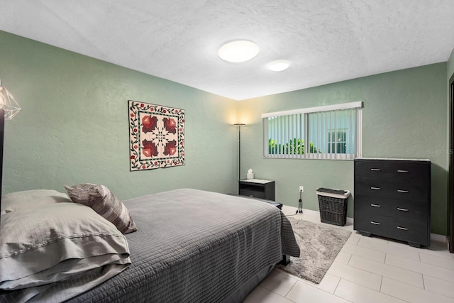 bedroom featuring a textured ceiling