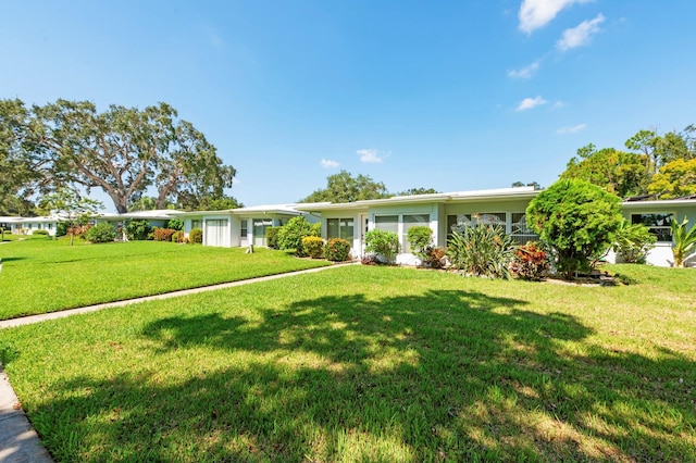 ranch-style house with a front yard