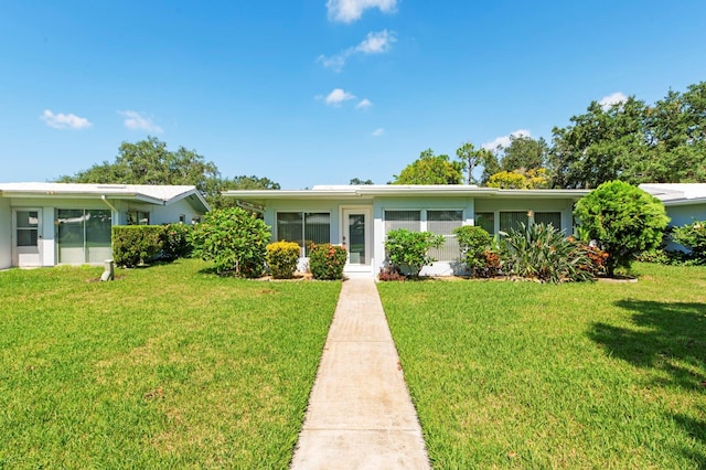 single story home featuring a front yard