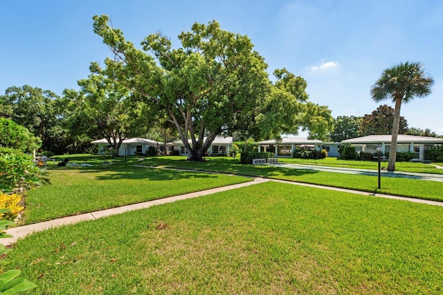 view of home's community featuring a yard