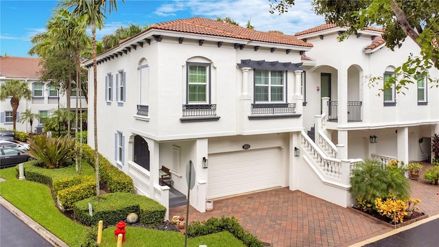 mediterranean / spanish-style home featuring a garage