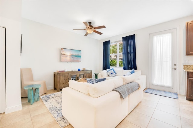 tiled living room featuring ceiling fan