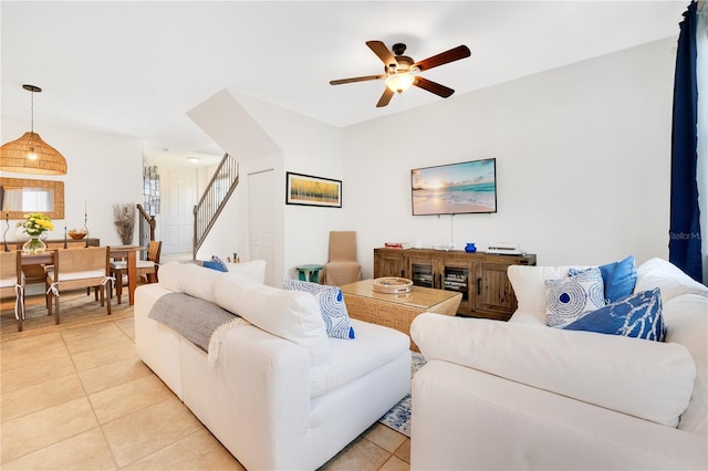 living room with ceiling fan and light tile patterned floors