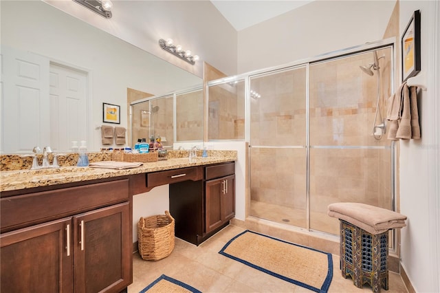 bathroom with walk in shower and vanity