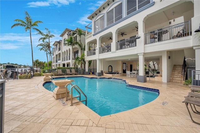 view of swimming pool with a patio