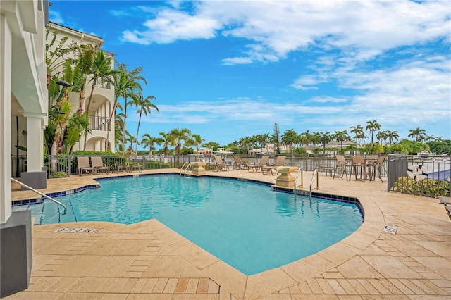 view of swimming pool with a patio