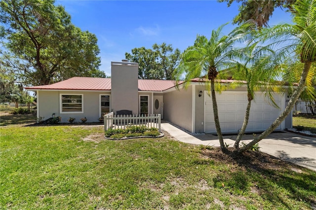 3240 Flamingo Ln, Mulberry, FL 33860 - view of front of property featuring stucco siding, a metal roof, concrete driveway, a garage, and a chimney