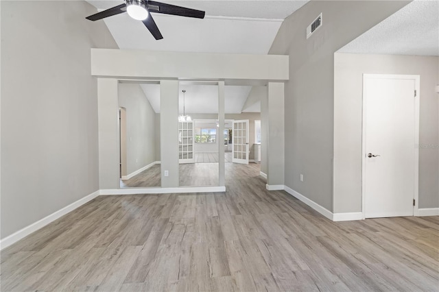 3240 Flamingo Ln, Mulberry, FL 33860 - unfurnished room with lofted ceiling, a ceiling fan, and wood finished floors