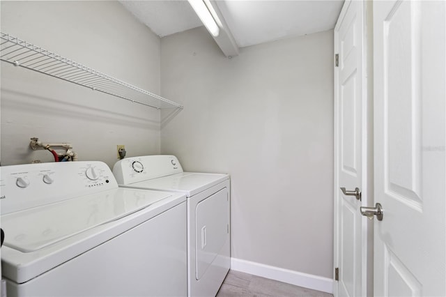 3240 Flamingo Ln, Mulberry, FL 33860 - laundry room with separate washer and dryer and light wood finished floors