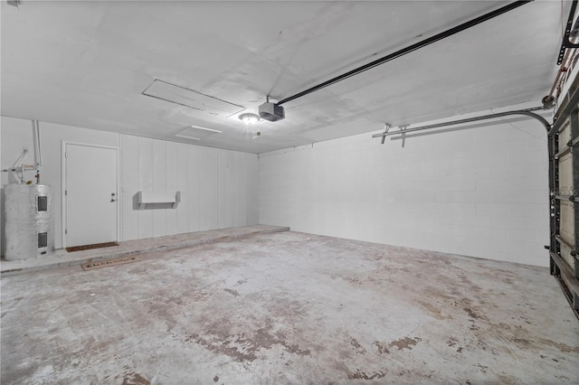 3240 Flamingo Ln, Mulberry, FL 33860 - garage featuring electric water heater and a garage door opener
