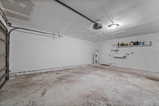 3240 Flamingo Ln, Mulberry, FL 33860 - garage with a garage door opener and water heater