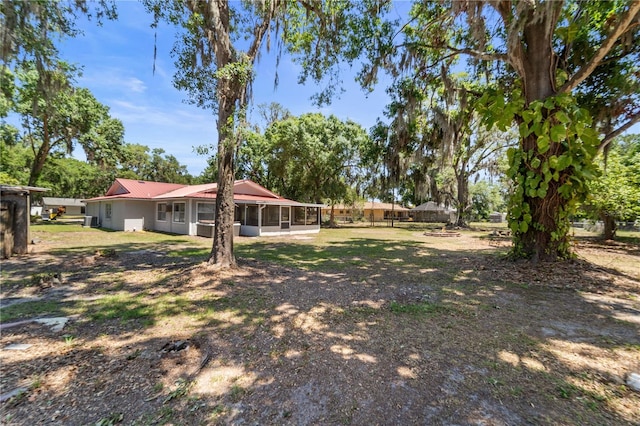 3240 Flamingo Ln, Mulberry, FL 33860 - view of yard featuring a sunroom