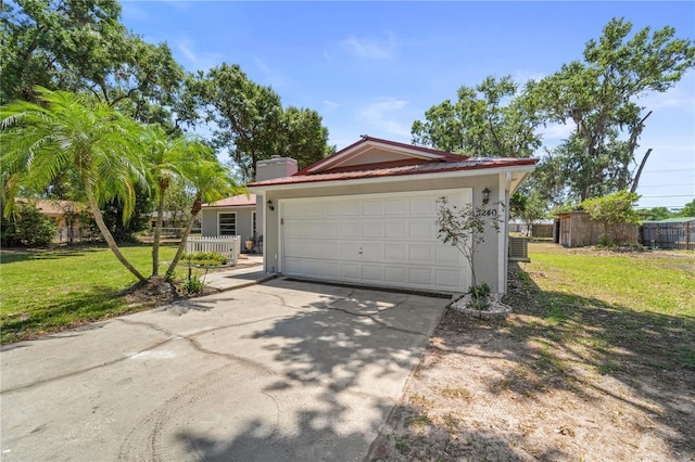 3240 Flamingo Ln, Mulberry, FL 33860 - view of front of property featuring driveway, an attached garage, stucco siding, and a chimney