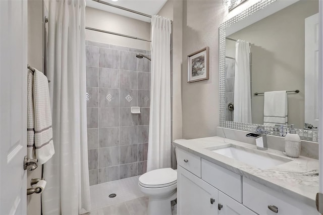 bathroom featuring vanity, toilet, tile patterned floors, and walk in shower