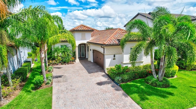 mediterranean / spanish house with a front yard