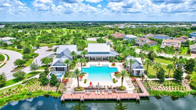 birds eye view of property with a water view