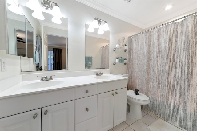 bathroom featuring toilet, tile patterned floors, crown molding, vanity, and curtained shower