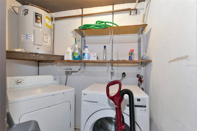 clothes washing area with independent washer and dryer and water heater