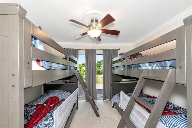 carpeted bedroom with ceiling fan, access to exterior, and crown molding