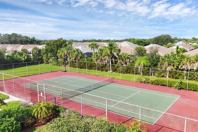 view of tennis court with basketball hoop