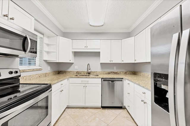 6384 Draw Ln Unit 38, Sarasota, FL 34238 - kitchen with stainless steel appliances, a sink, a textured ceiling, crown molding, and white cabinetry
