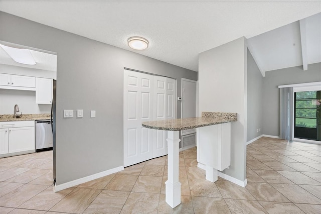 6384 Draw Ln Unit 38, Sarasota, FL 34238 - kitchen featuring dishwasher, white cabinetry, light stone countertops, light tile patterned floors, and lofted ceiling