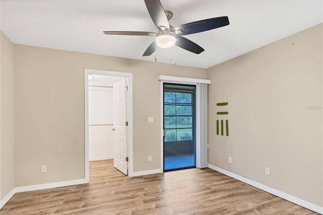6384 Draw Ln Unit 38, Sarasota, FL 34238 - empty room featuring wood finished floors, a ceiling fan, and baseboards
