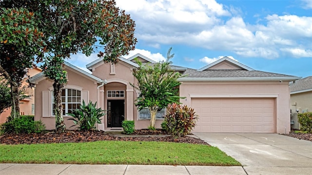 single story home featuring a garage