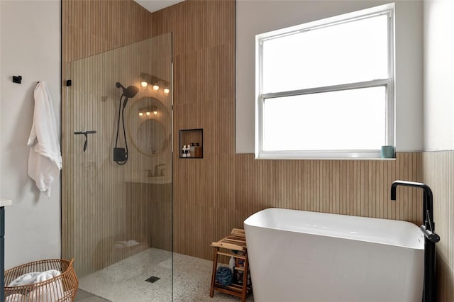 bathroom featuring plus walk in shower