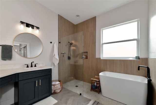 bathroom featuring independent shower and bath and vanity