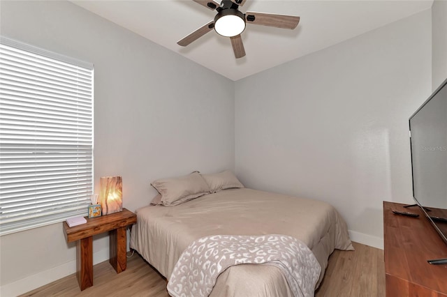 bedroom featuring ceiling fan and light wood-type flooring