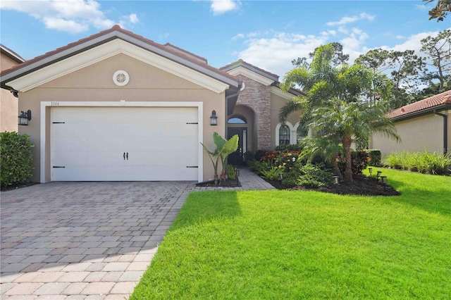 view of front facade with a garage and a front yard