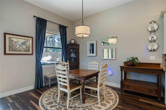 dining area with dark hardwood / wood-style floors