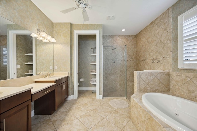 full bathroom featuring shower with separate bathtub, vanity, tile patterned flooring, toilet, and ceiling fan