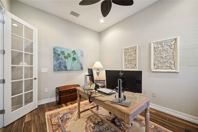 office area featuring dark wood-type flooring and ceiling fan