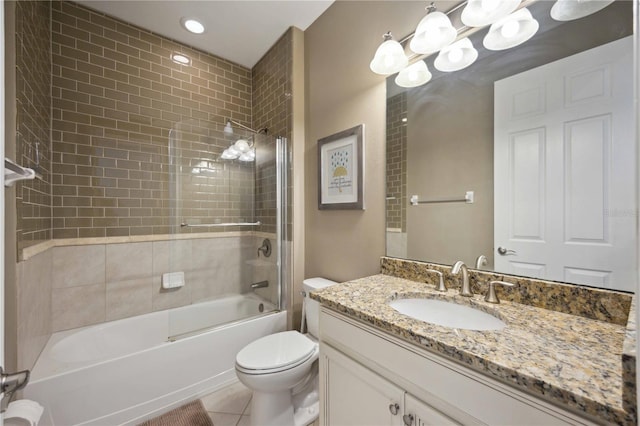 full bathroom with tile patterned flooring, vanity, toilet, and tiled shower / bath