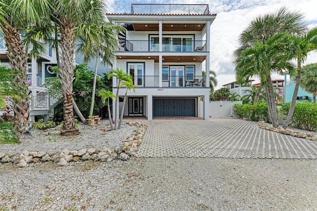 exterior space featuring a garage and a balcony