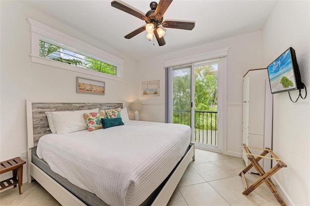 tiled bedroom with ceiling fan, multiple windows, and access to outside