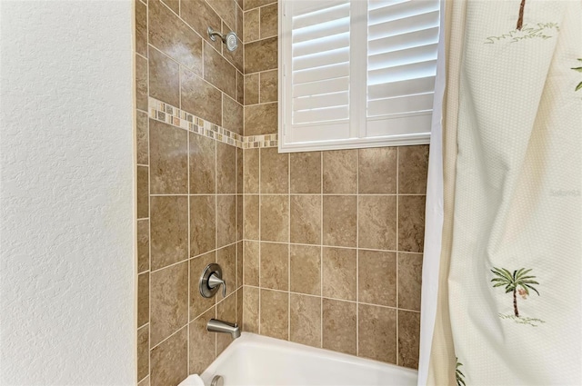 bathroom with shower / bathtub combination with curtain