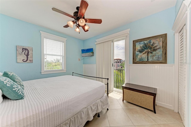 tiled bedroom with ceiling fan